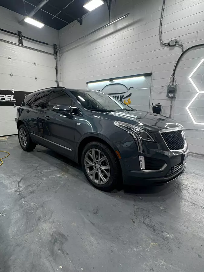 Ceramic window film installation on luxury car in Hamilton